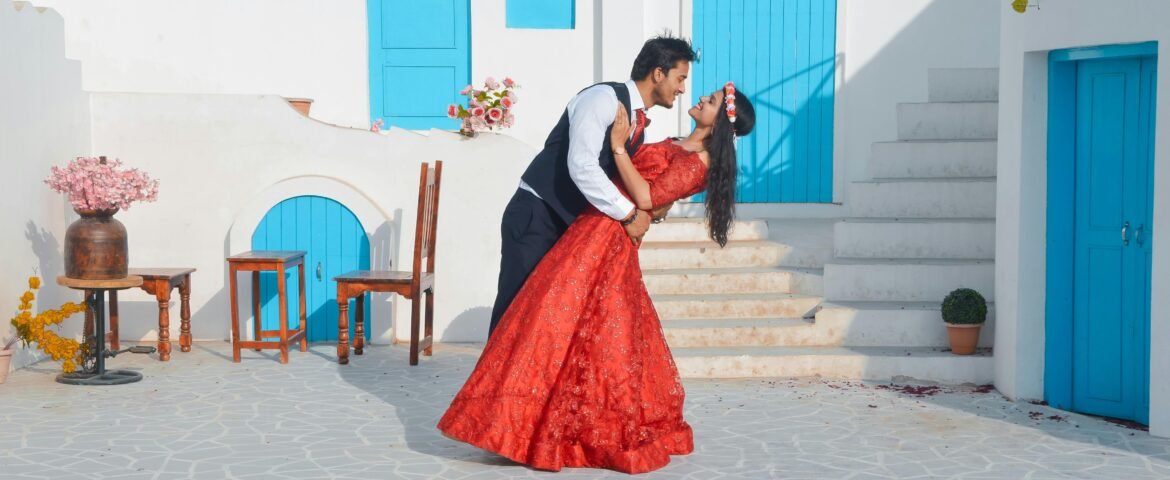 Bride and groom sharing a romantic moment in a Santorini-style courtyard.