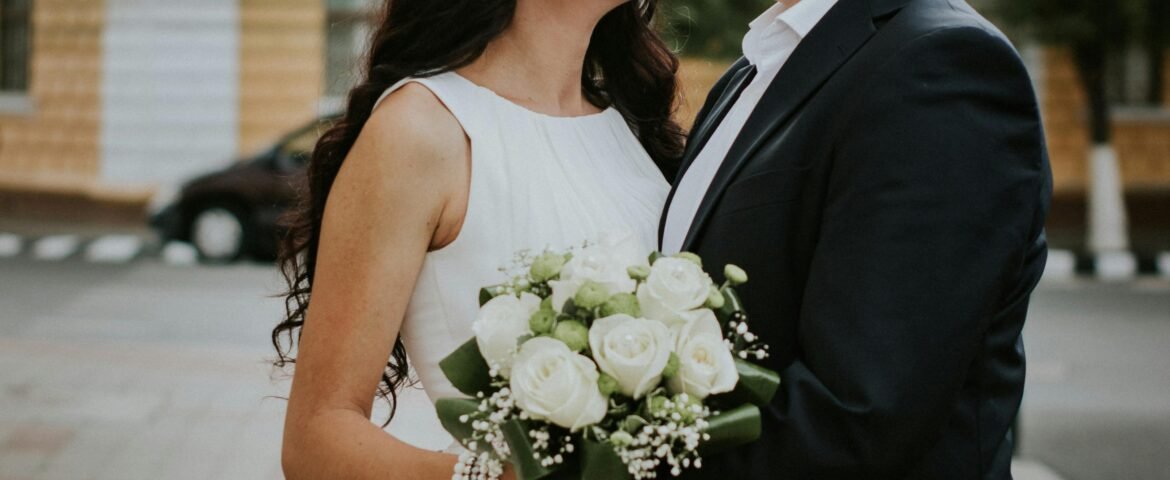 A joyful couple celebrating their wedding day in the charming streets of Jibert, Romania.